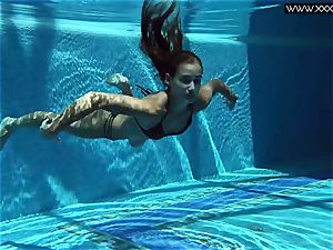 Tiffany Tatum unclothes naked underwater